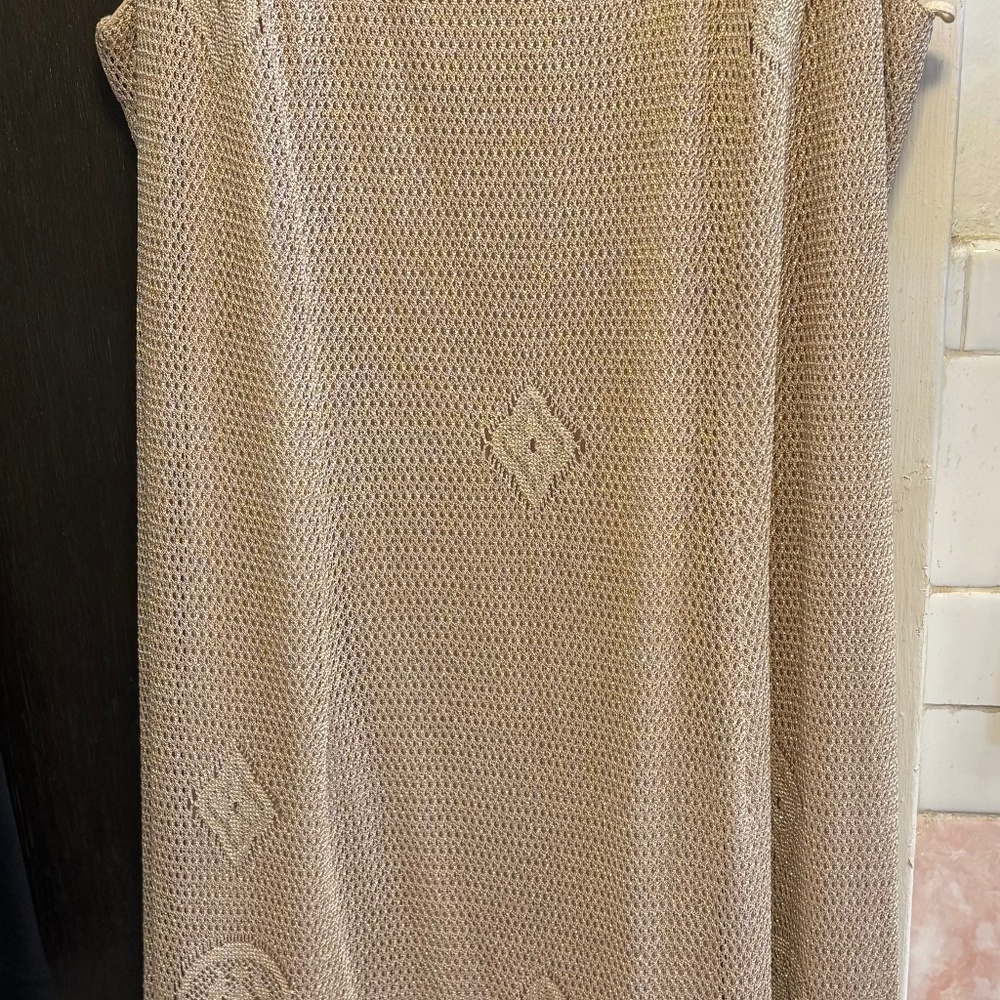 This is a vintage Onyx Nite formal dress with a lace overlay and fringe detail.